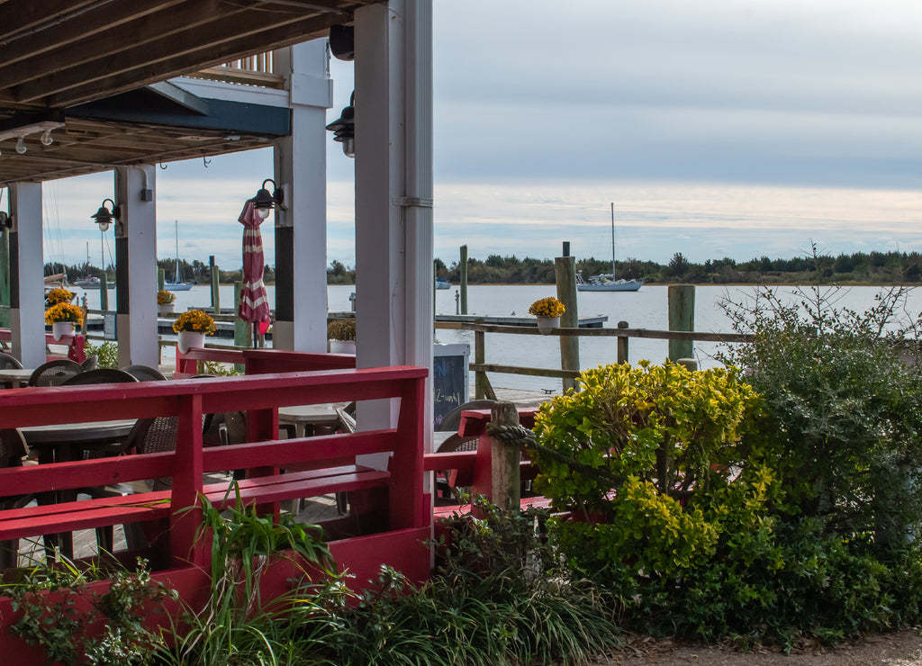 Boats on the water, blue sky above, scenes from historic waterfront Beaufort North Carolina