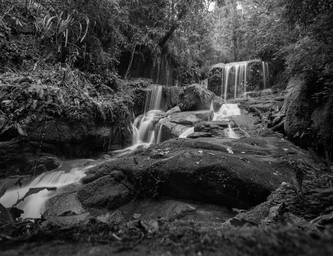 Noah Jigsaw Puzzle The blue fishing boats and in the background the tower of the Sqala, Essaouira, Morocco in black white 1000 pieces