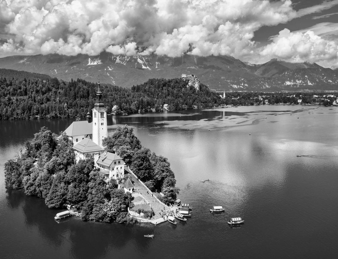 Noah Jigsaw Puzzle Aerial view Beaumont Texas cityscape with modern and historic buildings, fuel tanks, trading house and harbor and oil refineries in the background with partly cloudy blue sky in black white 1000 pieces