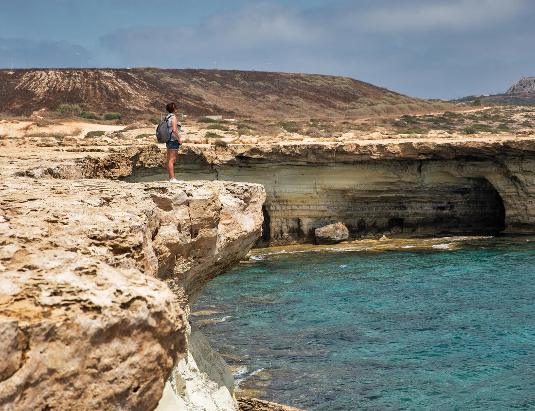 Seascape Cape Greco peninsula park with woman standing over a cliff, Cyprus 1000pc Puzzle