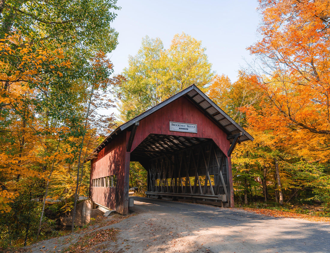 Noah Jigsaw Puzzle Autumn in Stowe Vermont Brookedale Covered Bridge Historic Red Wooden Roof Over Road Into Colorful Fall Foliage Forest on Bright October Day 1000 pieces