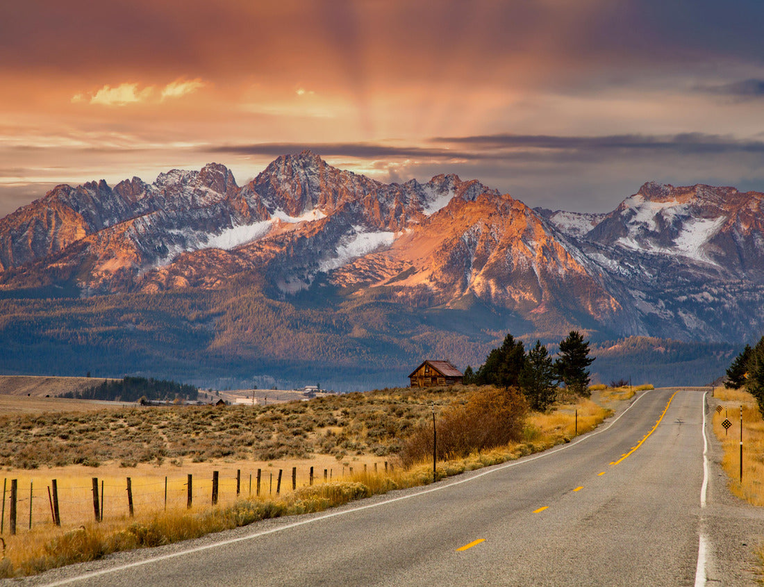 The Sawtooth Mountains and a log cabin at sunrise and highway 75 leading to Stanley, Idaho 1000pc Puzzle