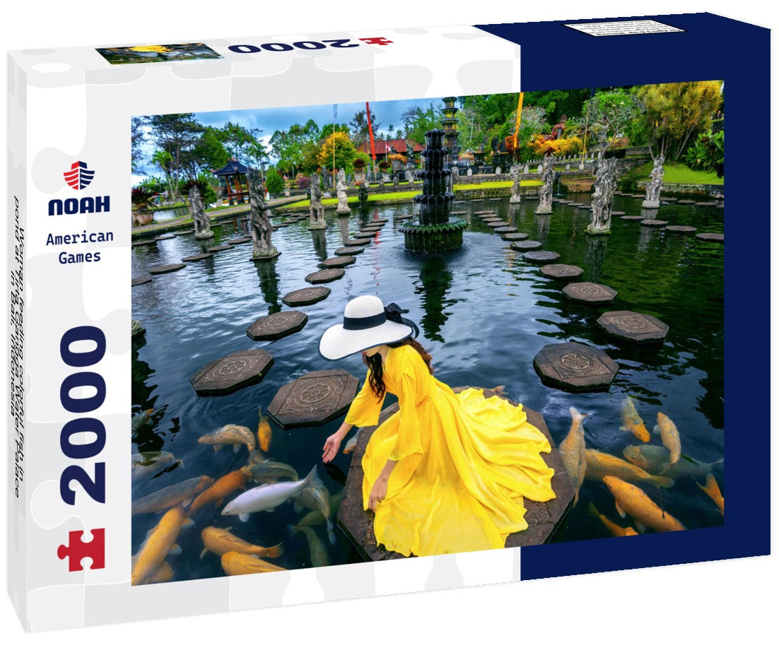 Woman feeding colorful fish in pond at Tirta Gangga Water Palace in Bali, Indonesia 2000pc Puzzle