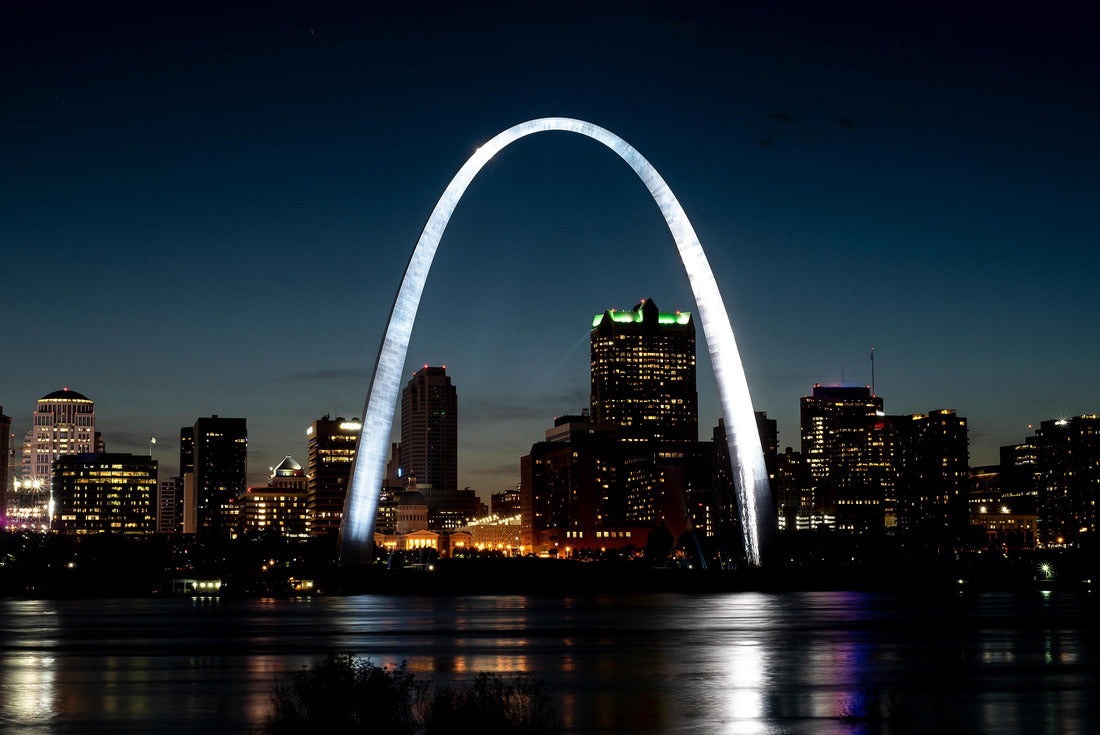 St. Louis gateway arch reflecting shining light at night on Mississippi River in foreground, tall office buildings and skyline in background 2000pc Puzzle