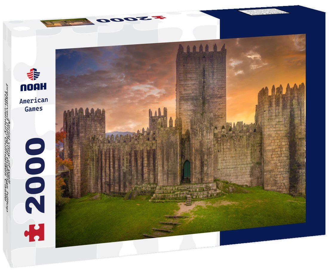 Aerial view of well-preserved medieval buildings hilltop, 10th-century Guimarães Castle with stunning sunset orange sky 2000pc Puzzle