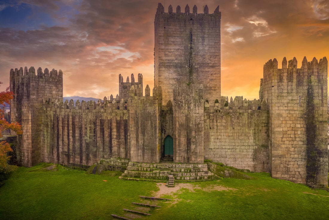 Aerial view of well-preserved medieval buildings hilltop, 10th-century Guimarães Castle with stunning sunset orange sky 2000pc Puzzle