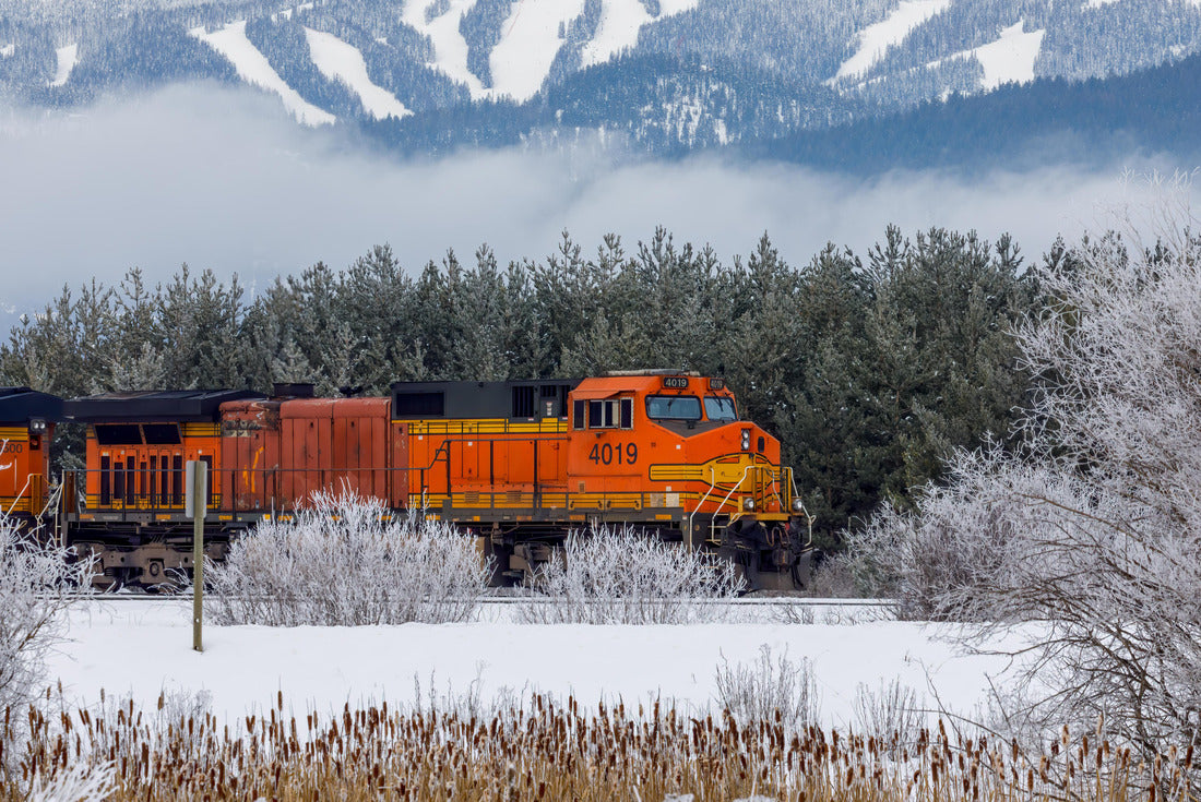 Locomotive pulling train in winter close to Whitefish, Montana with Whitefish ski resort in background 2000pc Puzzle