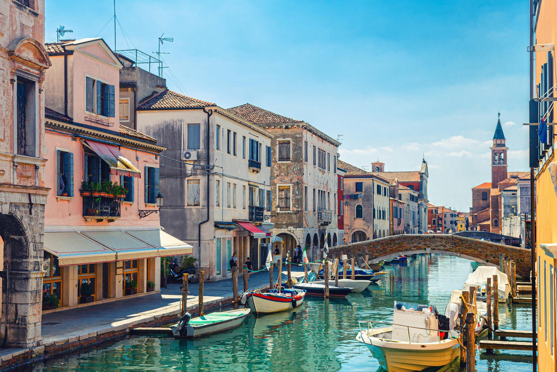 Chioggia cityscape with narrow water channel Vena with colorful boats between old buildings and brick bridge, blue sky background in summer, Veneto region, northern Italy 2000pc Puzzle