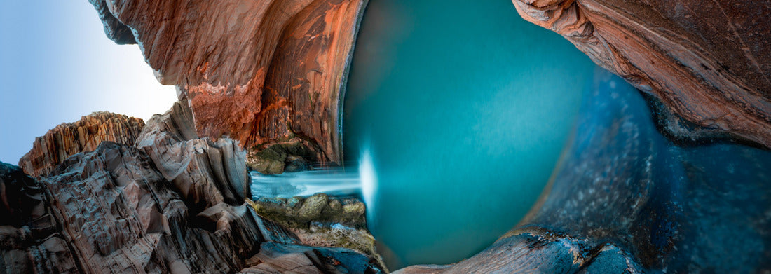 Noah Jigsaw Puzzle Beautiful turquoise waterfall flows into natural pool surrounded by red rock formation in Karijini National Park in Western Australia panorama 1000 pieces