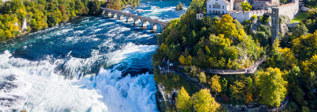 Noah Jigsaw Puzzle Rhine Falls or Rheinfall, Switzerland panoramic view. Tourist boat in the waterfall. Bridge and border between the cantons of Schaffhausen and Zurich. Laufen Castle, Laufen-Uhwiesen on the mountain top panorama 1000 pieces