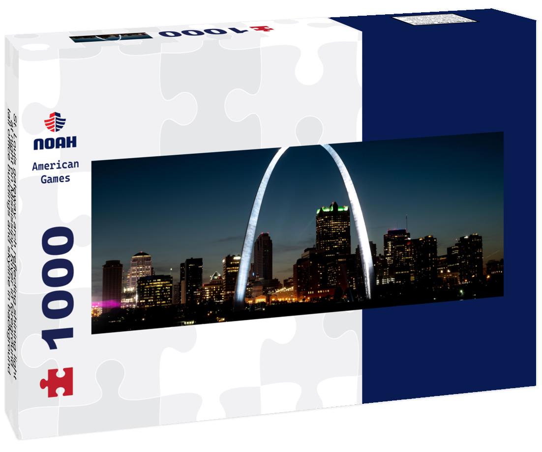 St. Louis gateway arch reflecting shining light at night on Mississippi River in foreground, tall office buildings and skyline in background 1000pc Panoramic Puzzle