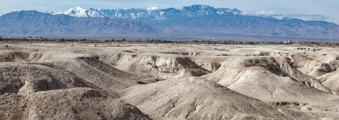 USA, Nevada, Clark County, Tule Fossil Beds National Monument: White gypsum hills at the urban fringe along the Las Vegas Wash with Mt. Charleston in the distance 1000pc Panoramic Puzzle
