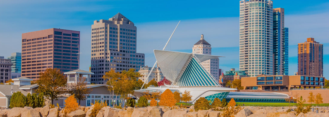 Noah Jigsaw Puzzle A rock breakwater holds back Lake Michigan, with the business district of Milwaukee, Wisconsin sitting behind it panorama 1000 pieces