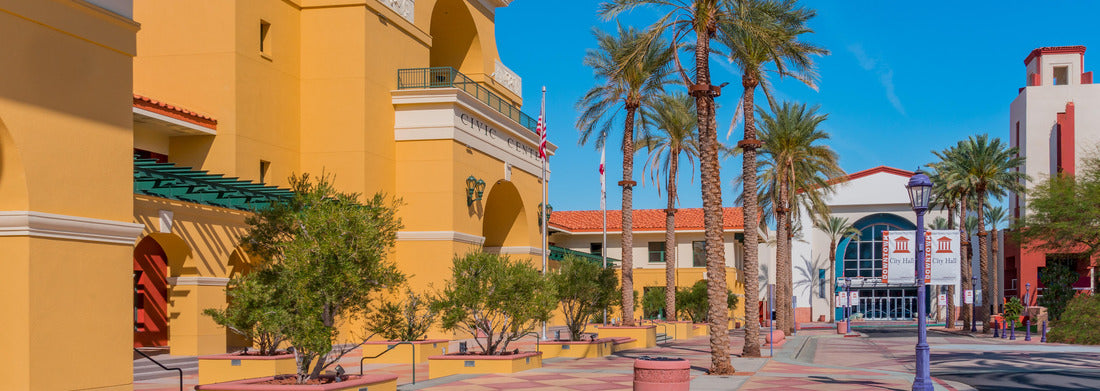 Noah Jigsaw Puzzle Cathedral City City Center is filled with color and interesting architecture. It is enhanced by palm trees and vegetation. Cathedral City is adjacent to Palm Springs in the southern California desert panorama 1000 pieces