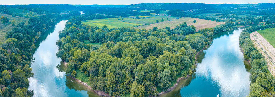 Noah Jigsaw Puzzle An aerial view of lush forestry and the bend of the Kentucky River with a boat on the water and cloud reflections in the sky panorama 1000 pieces