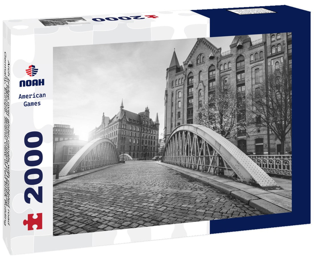 Arch bridge over alster canals with cobbled road in historical Speicherstadt of Hamburg, Germany, Europe. Scenic view of red brick building lit by golden sunset light 2000pc PuzzleBlack and White