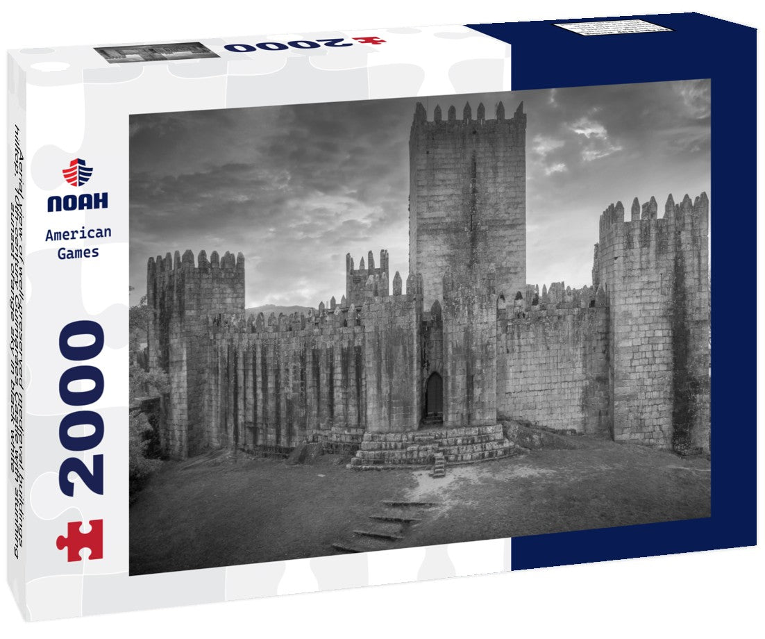 Aerial view of well-preserved medieval buildings hilltop, 10th-century Guimarães Castle with stunning sunset orange sky 2000pc PuzzleBlack and White