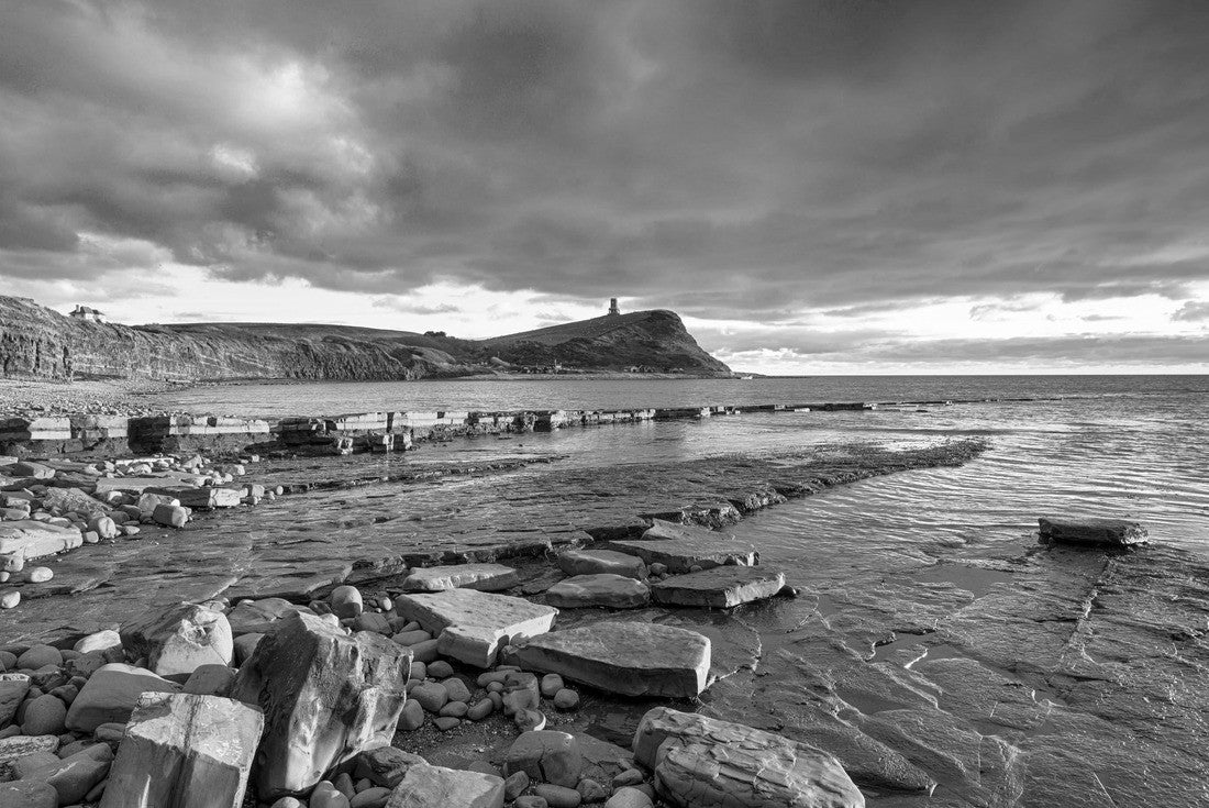 Noah Jigsaw Puzzle Dramatic sky over Kimmeridge Bay on the Jurassic Coast of Dorset, looking out to Hen Cliff with Clavel Tower perched on top in black white 2000 pieces