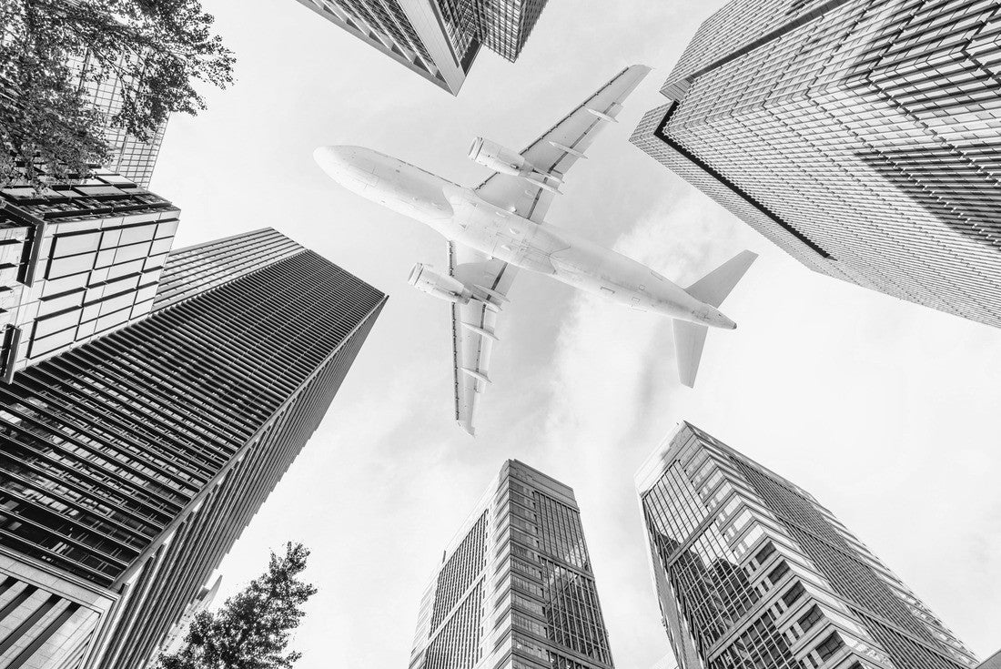 Aircraft flying above glass office buildings in the sky over city buildings in financial district of Tokyo city, Japan 2000pc PuzzleBlack and White