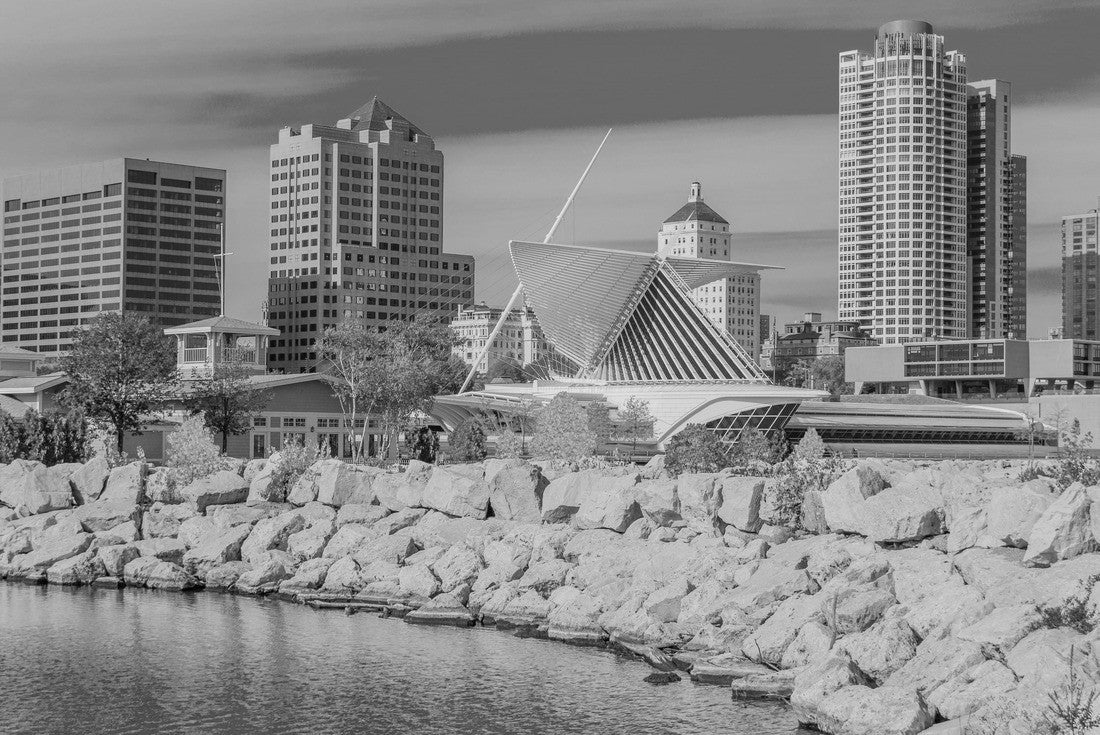 A rock breakwater holds back Lake Michigan, with the business district of Milwaukee, Wisconsin sitting behind it 2000pc PuzzleBlack and White