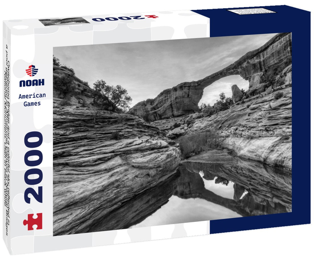 Owachomo Bridge and a colorful sky reflected in a pool gathered in Armstrong Canyon in Natural Bridges National Monument, Utah 2000pc PuzzleBlack and White