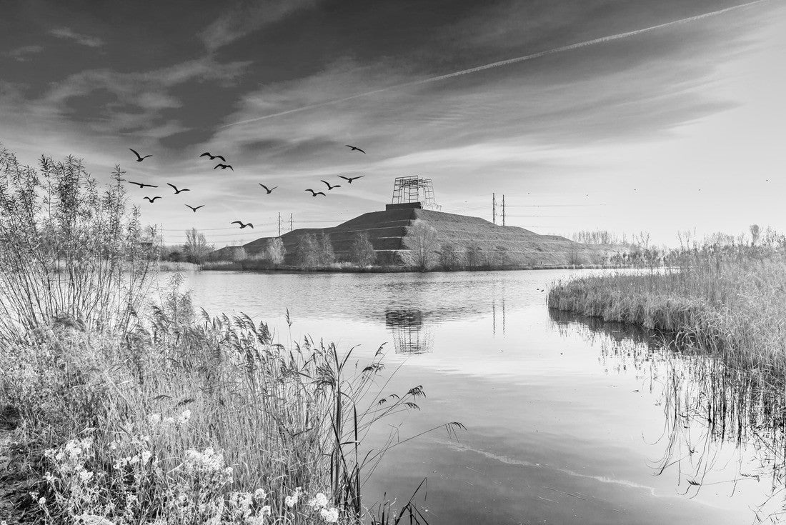 Landscape recreation area de Groene Weelde with view over water to pyramidal hill Big Spotters Hill between Hoofddorp and Vijfhuizen on dark sky and low sun 2000pc PuzzleBlack and White