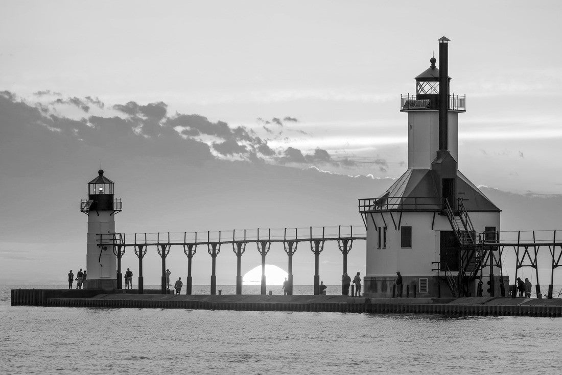 Noah Jigsaw Puzzle At the summer solstice, the sun rises over Lake Michigan between the Inner and Outer North Lighthouse in St. Joseph, Michigan in black white 2000 pieces