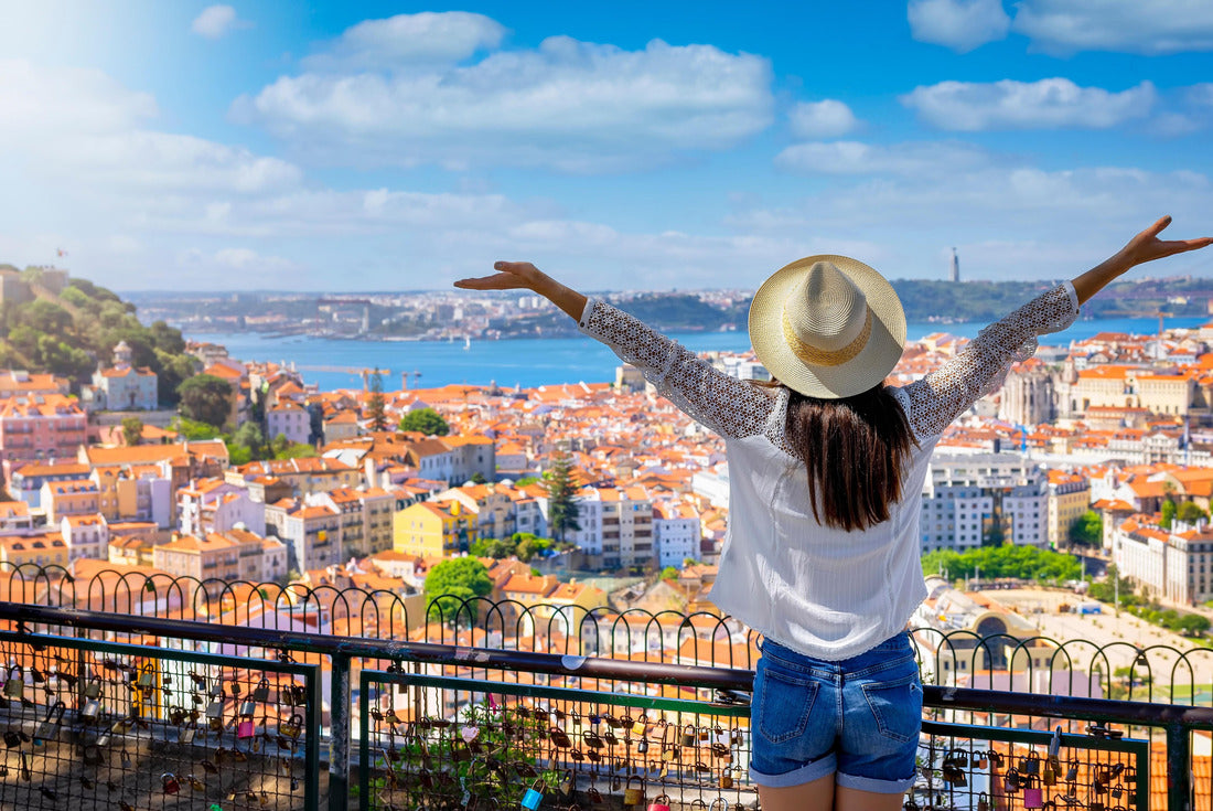 A happy tourist woman overlooks the colorful old town Alfama of Lisbon city, Portugal, and castle Sao Jorge on her sightseeing trip 2000pc Puzzle