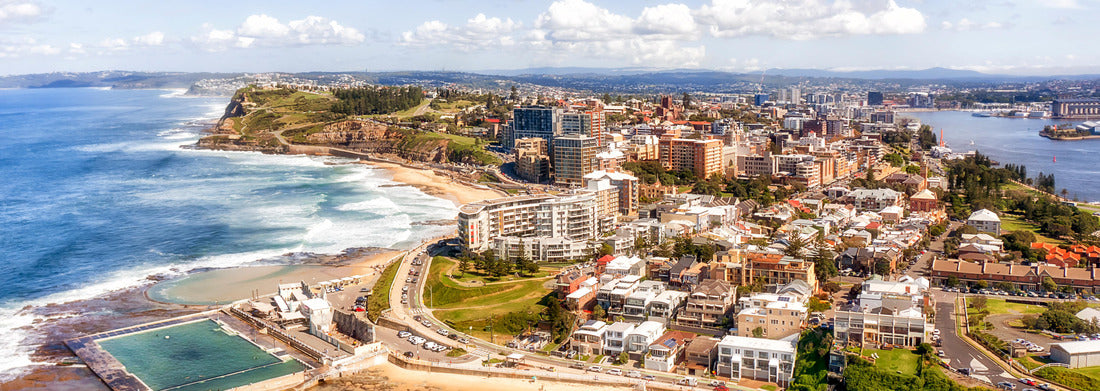 Noah Jigsaw Puzzle Panorama of Newcastle city on the hills over Hunter river and Pacific ocean with beaches, pool and surfers panorama 1000 pieces