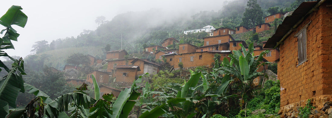 Noah Jigsaw Puzzle Small African village with houses on a mountain between banana trees on a mountain in Togo panorama 1000 pieces