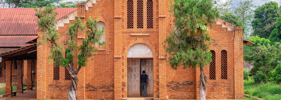 Noah Jigsaw Puzzle African man stepping into the doorway of a small church at the Cathedral Bangui, Notre Dame, famous church in the Central African Republic panorama 1000 pieces