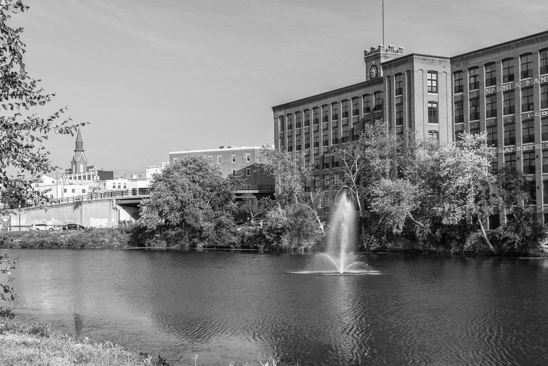 Fountain on the Nashua River against the background of a historic cotton factory building with a clock tower in the old industrial park of Nashua. New Hampshire, USA 2000pc PuzzleBlack and White