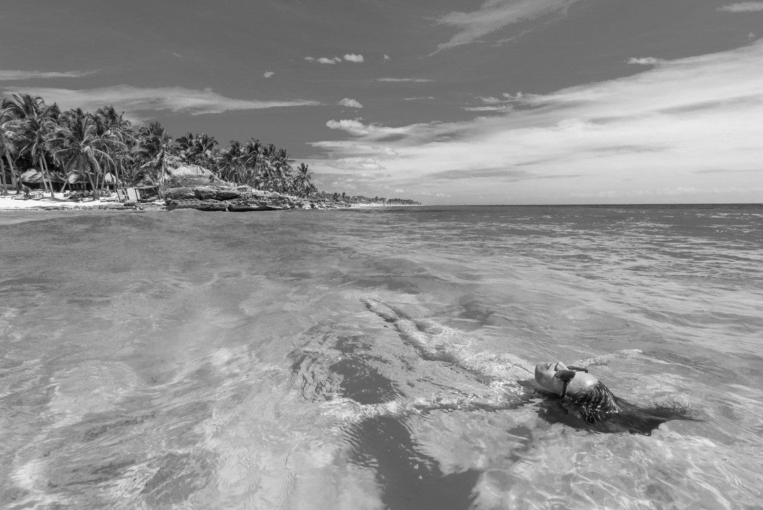 Attractive young woman relaxing in the turquoise waters of the Caribbean Sea in front of Paradise Beach in Tulum, near Cancun, Riviera Maya, Mexico 2000pc PuzzleBlack and White