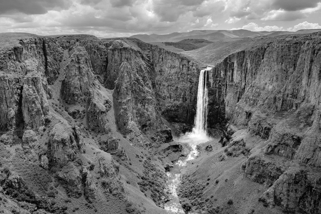 Noah Jigsaw Puzzle Maletsunyane Falls in Lesotho Africa. Most beautiful waterfall in the world. Green scenic landscape of amazing water fall dropping into a river inside canyons in black white 2000 pieces