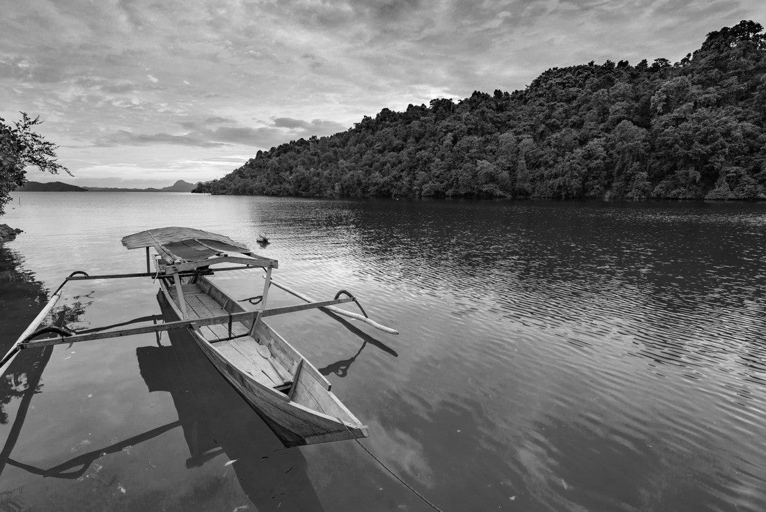 Togean Islands, Indonesia Sunset over the Caribbean Sea, dramatic sky, traditional boat floating on a blue-green lagoon in the Togean Islands, Sulawesi, travel destination in Indonesia 2000pc PuzzleBlack and White