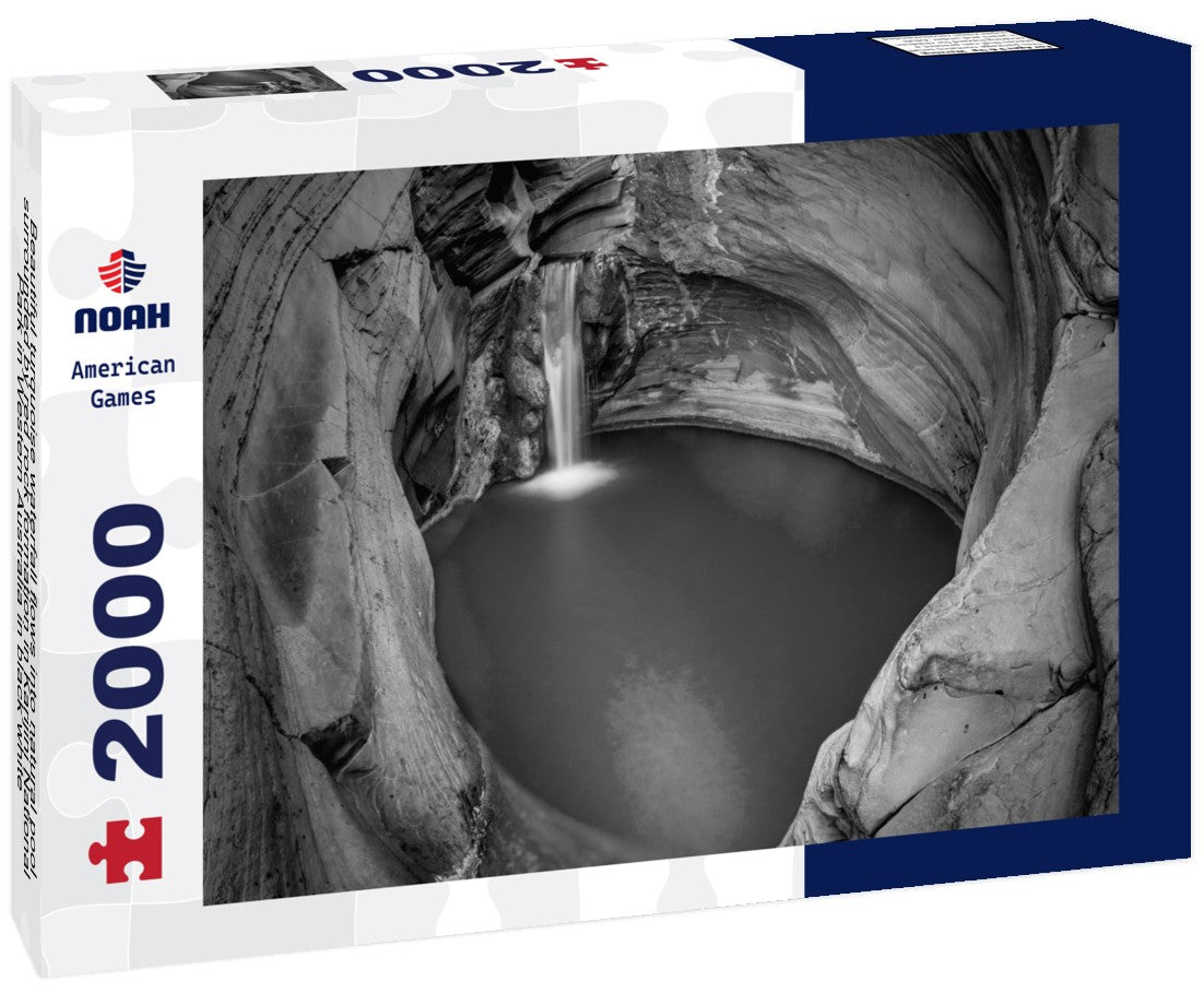 Beautiful turquoise waterfall flows into natural pool surrounded by red rock formation in Karijini National Park in Western Australia 2000pc PuzzleBlack and White