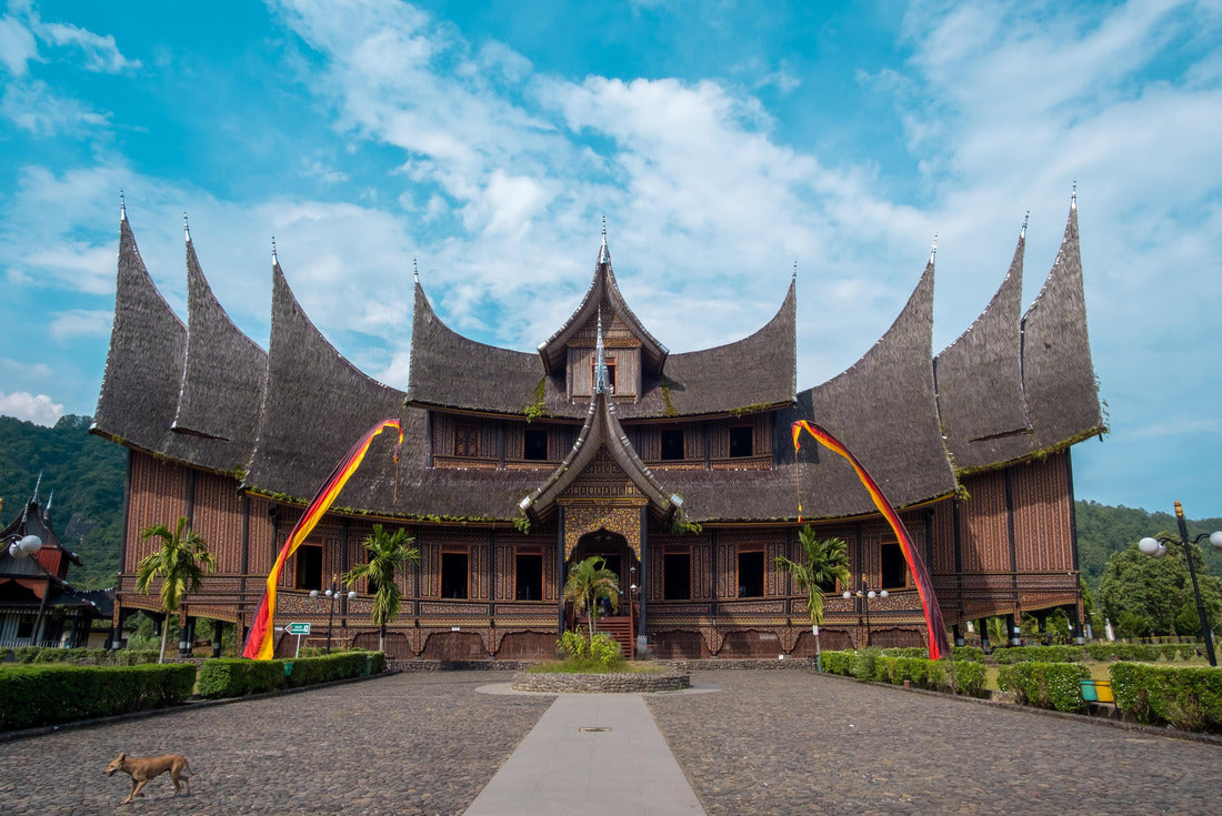 The dog walk in front of Pagaruyung Palace (the traditional Minangkabau Rumah Gadang vernacular architectural style) with blue sky and white clouds background 2000pc Puzzle
