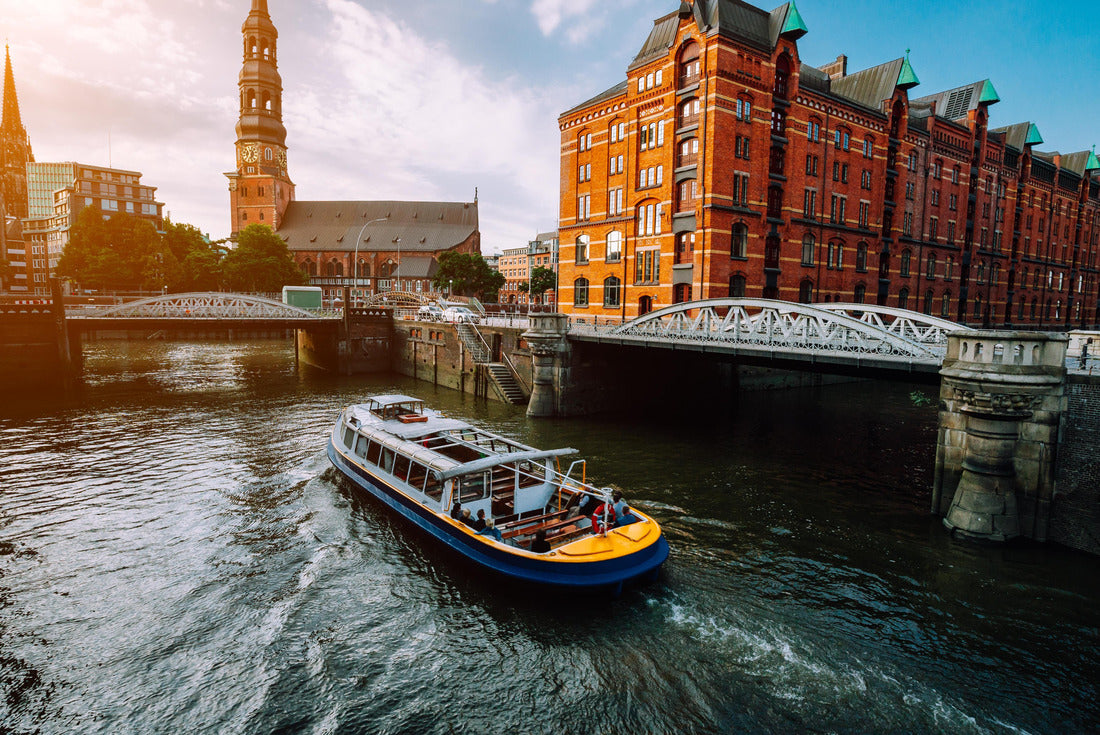 Touristic cruise boat on a channel with bridges in the old warehouse district Speicherstadt in Hamburg in golden hour sunset light, Germany 2000pc Puzzle
