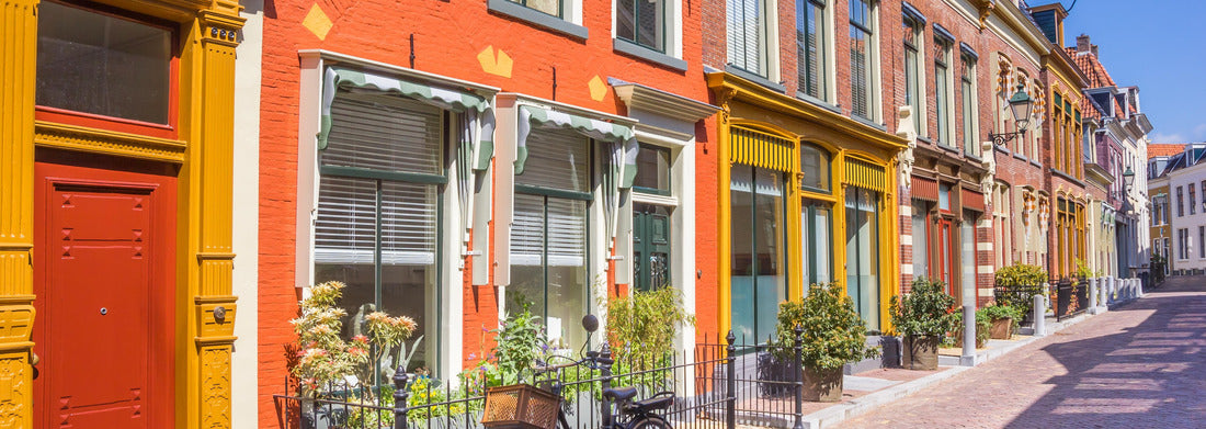 Noah Jigsaw Puzzle Bicycle in front of colorful houses in the historic city of Leeuwarden, Netherlands panorama 1000 pieces