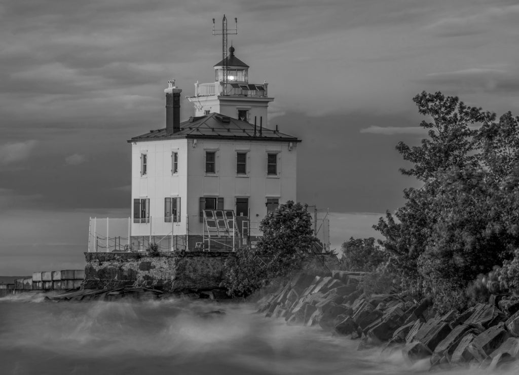 Fairport Harbor West Breakwater Lighthouse located in Headland Dunes State Nature Preserve in Ohio in black white