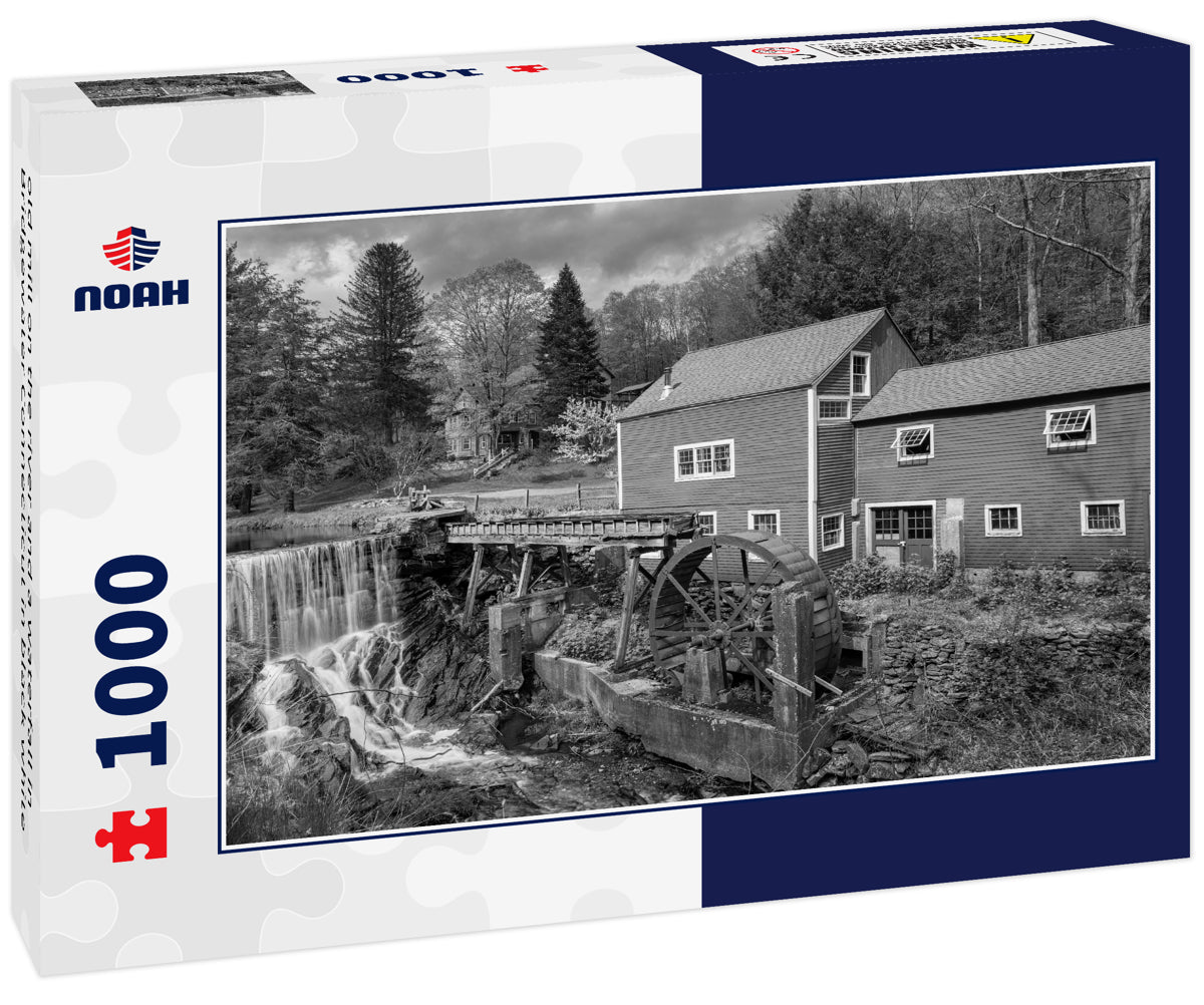 old mill on the river and a waterfall in Bridgewater Connecticut in black white