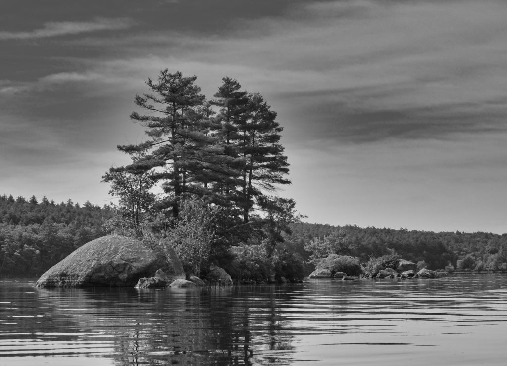 Island rocks on Lake Massabesic, New Hampshire in black white