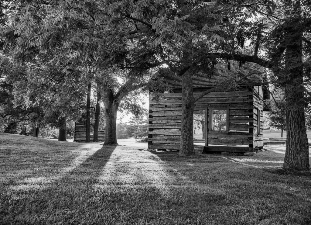 Log structure in David Rogers Park. This is a public park found in rural LaGrange County Indiana. It features a collection of log cabins in black white