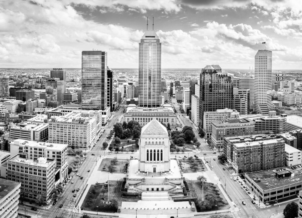 Aerial view of Indianapolis, Indiana skyline above Indiana World War Memorial and University park, and along Meridian and Pennsylvania streets in black white