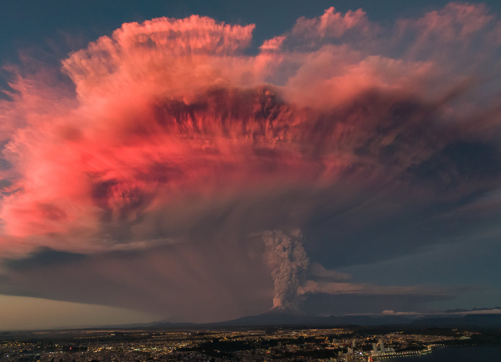 Volcanic eruption during sunset. The eruption of Calbuco volcano in Chilean Patagonia with beautiful colors of the sunset reflected on the ash column