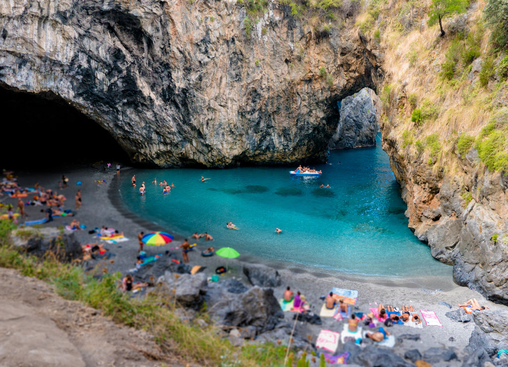 Arcomagno beach in Calabria with the characteristic natural rock arch.