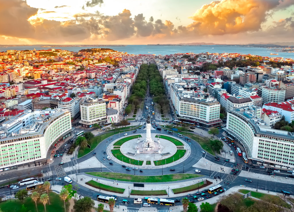 Lisbon skyline panorama, European city view on Marques Pombal square monument, sunset, crossroads, Portugal