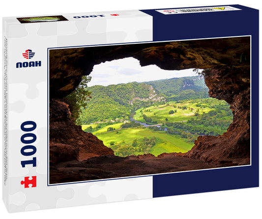 Window Cave (Cueva Ventana) in Arecibo near San Juan, Puerto Rico. View through lush green scenery through the cave opening shaped like a window that is at the end of hike