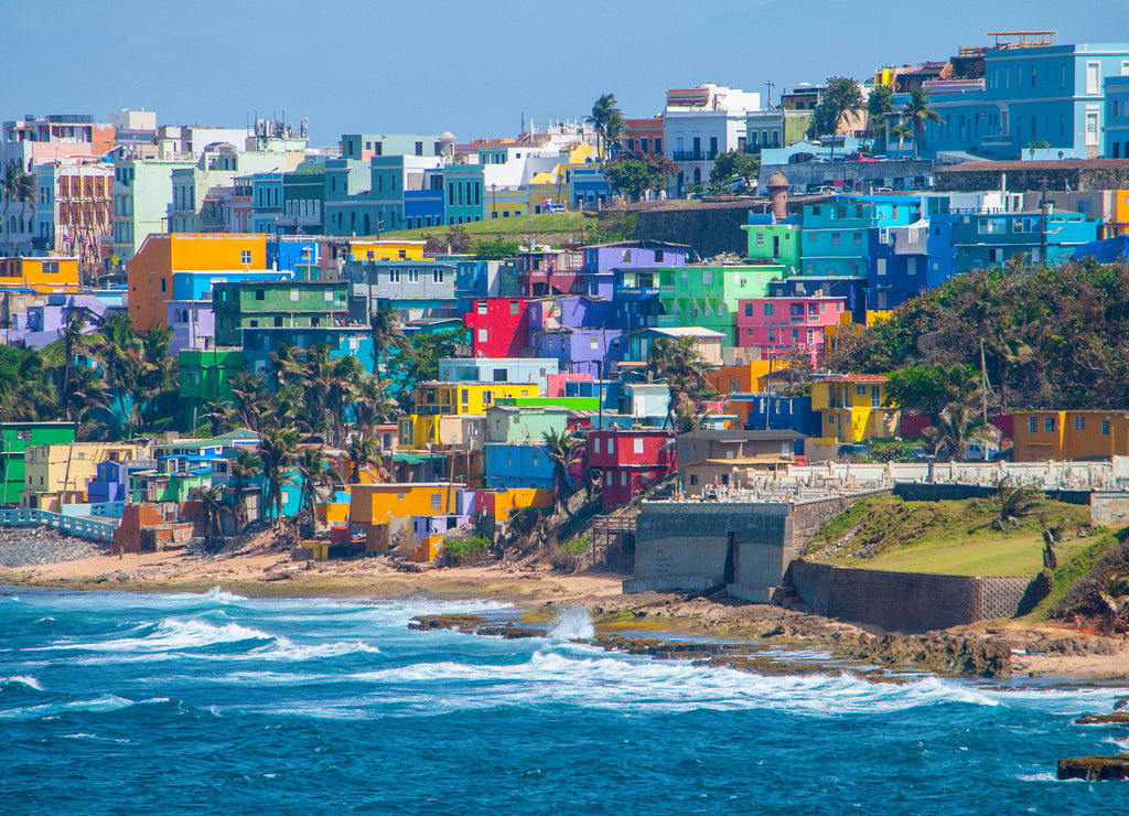 Colorful houses line the hill side overlooking the beach in San Juan, Puerto Rico