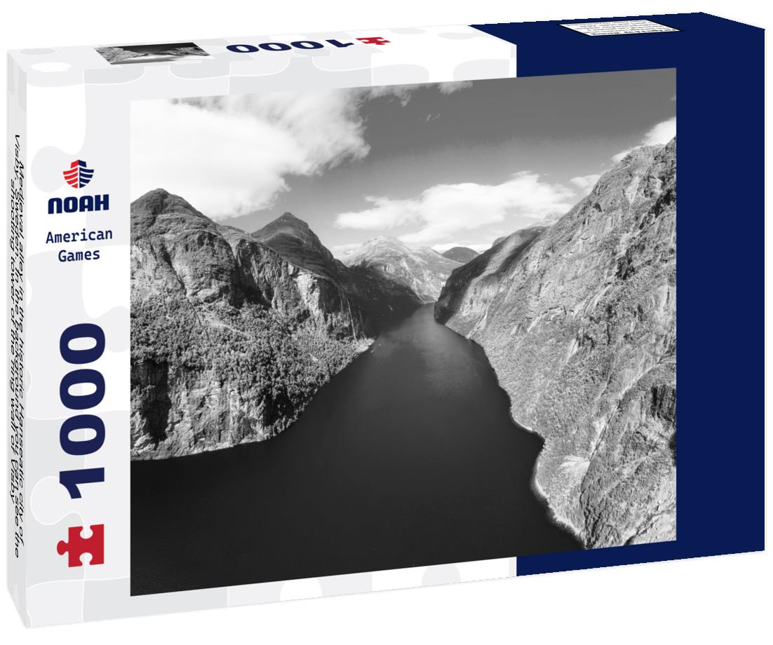 Noah Jigsaw Puzzle Medieval alley in the historic Hanseatic city of Visby, Sweden. In the background you can see the shooting tower of the ring wall of Visby, a UNESCO World Heritage Site in black white 1000 pieces